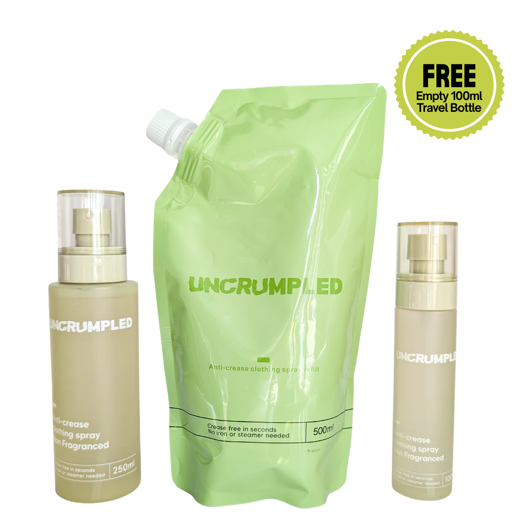 Uncrumpled anti-crease range featuring a large light green refill pouch in the center, regular sized spray bottle on its left and travel-sized spray bottle on the right. A green circular badge is in the top right that reads 'FREE Empty 100ml Travel Bottle'.