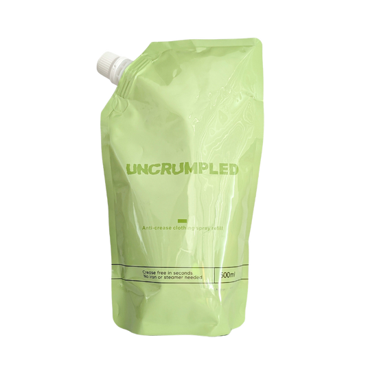 The Uncrumpled refill pouch, a 500ml light green resealable stand-up pouch with a white screw cap, isolated on a white background.